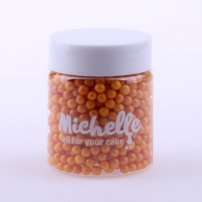 jedlé cukrové guličky na tortu v oranžovej farbe